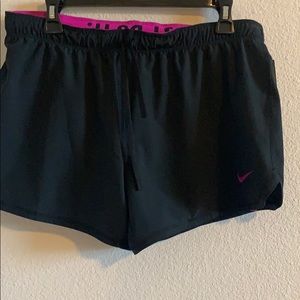 Black and magenta Nike dri fit shorts